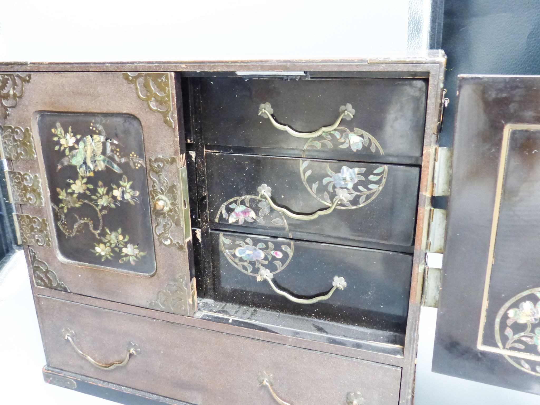 A Japanese lacquer and abalone inlaid table cabinet, 36.5cm wide